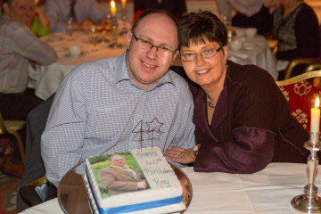 President Elect Roy Crawford and wife with cake