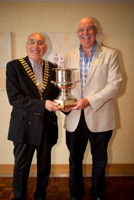 John Trimble receiving Rotarian of the Year Trophy